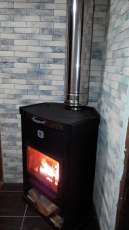 Стальной недорогой камин Теплодар ОВ-120 (угловой) фото в интерьере в Витебске