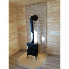 Чугунный камин со стеклом Сибирь 7 фото в интерьере в Витебске