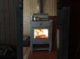 Стальной камин со стеклом Теплодар Кадриль фото в интерьере в Витебске