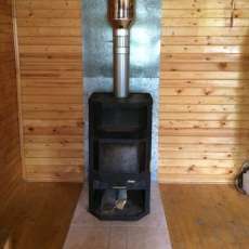 Печь-камин с шамотом Мета-Бел Ангара-Аква в интерьере фото в Витебске