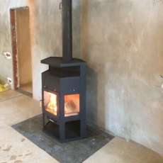 Купить недорогой камин с шамотом Мета-Бел Енисей в Витебске фото в интерьере в Витебске