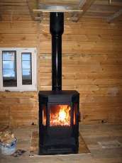 Печь-камин Бавария водяной с плитой в интерьере в Витебске