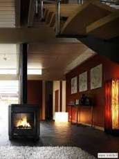 Печь-камин чугунный Invicta Carolo в интерьере Амазонка бай фото  в Витебске