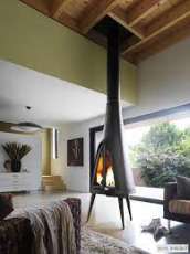 Печь-камин чугунный Invicta Pow-Wow в интерьере Амазонка бай фото в Витебске