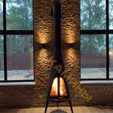 Печь-камин чугунный Invicta Pow-Wow в интерьере Амазонка бай фото в Витебске